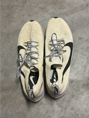 Nike Flyknit Sneakers in Cream with Black Swoosh